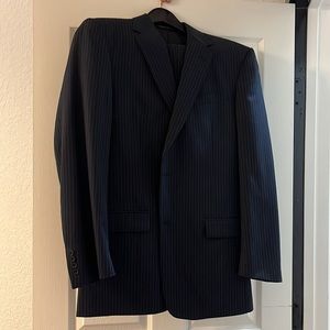 Men’s navy blue pinstripe suit.